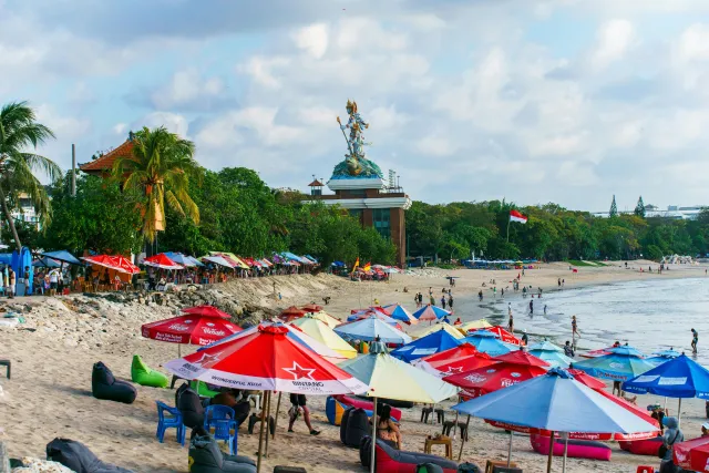 paddling stunning through surfer waves beach clear lone kuta bali the day at 1