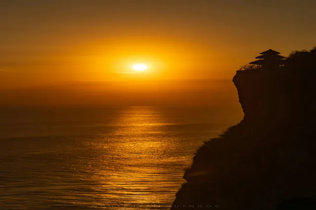 vibrant kecak dance performance at uluwatu temple bali against a stunning su 1