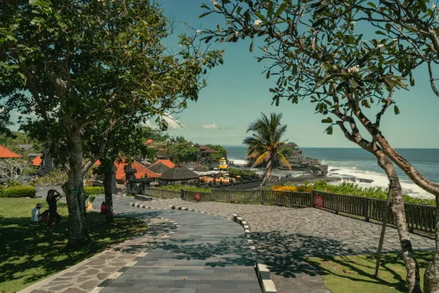 surrounded beautiful aerial temple shores tanah rocky ocean waves view bali  1